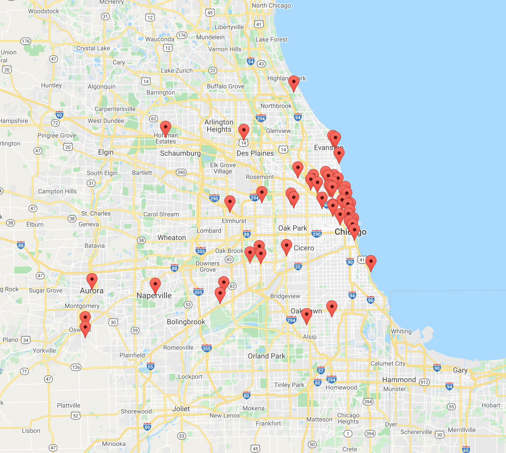 Photo of a map of Chicago. On the right, Lake Michigan is represented in blue, while the city to the left is gray with white lines representing the streets and yellow representing the highways. There are green areas representing parks across town. Red pins represent locations from where submissions were received. They are mainly grouped along the Northern coast of the city. A few more are scattered outwards towards the suburbs.